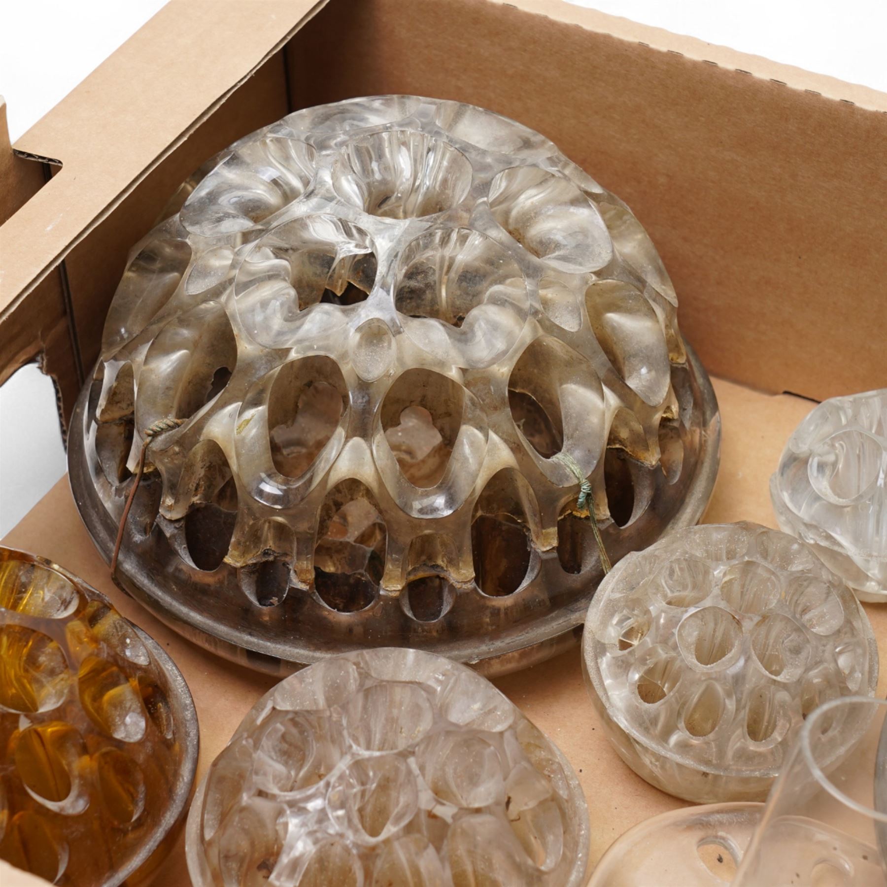 Ten glass pique fleurs or flower holders, in one box 
Provenance: from the Kirkham Hall estate. 