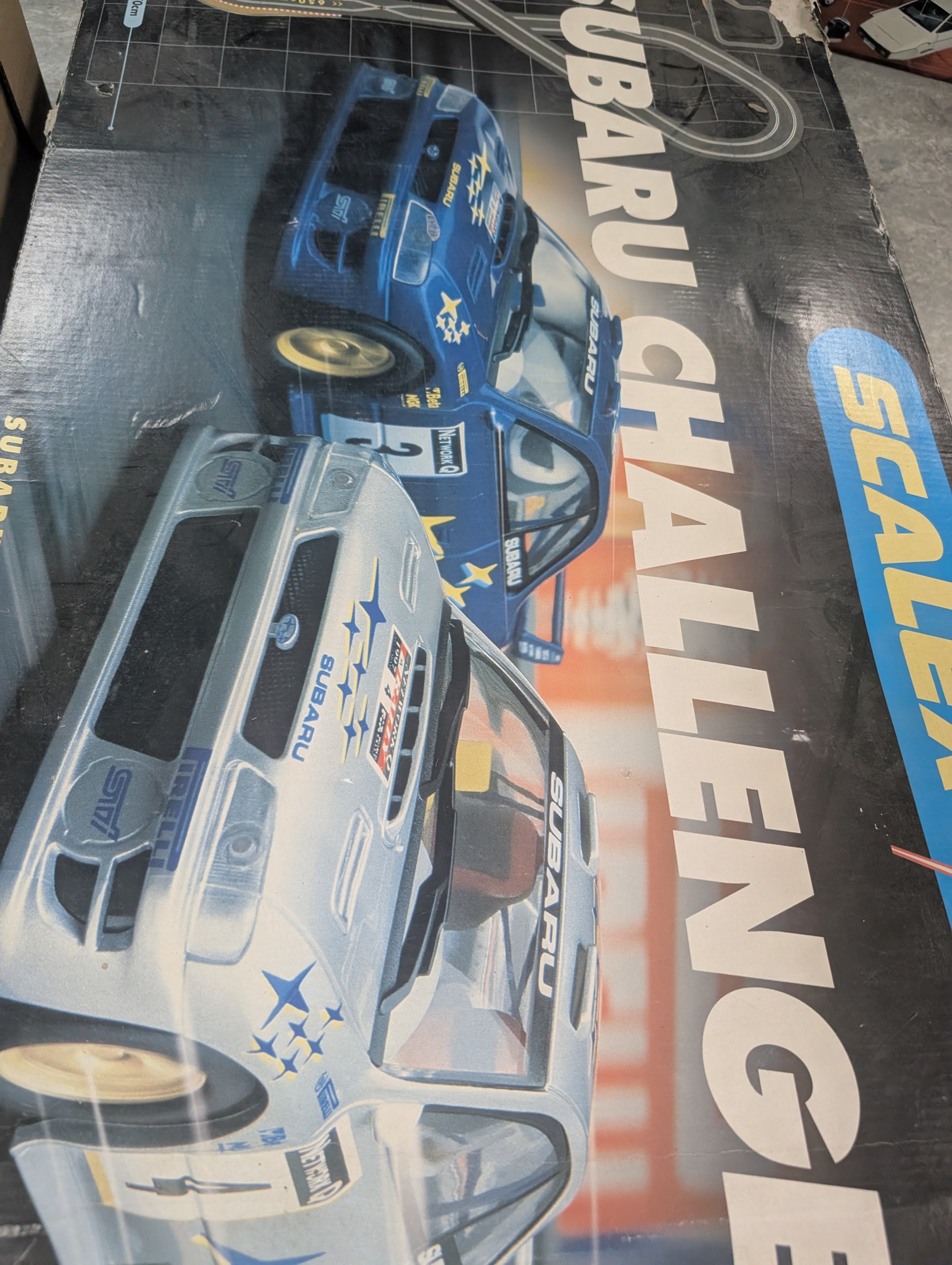 Scalextric Subaru Challenge set, boxed, collection of Scalextric track, building bricks, five Peggy Nesbit costume dolls