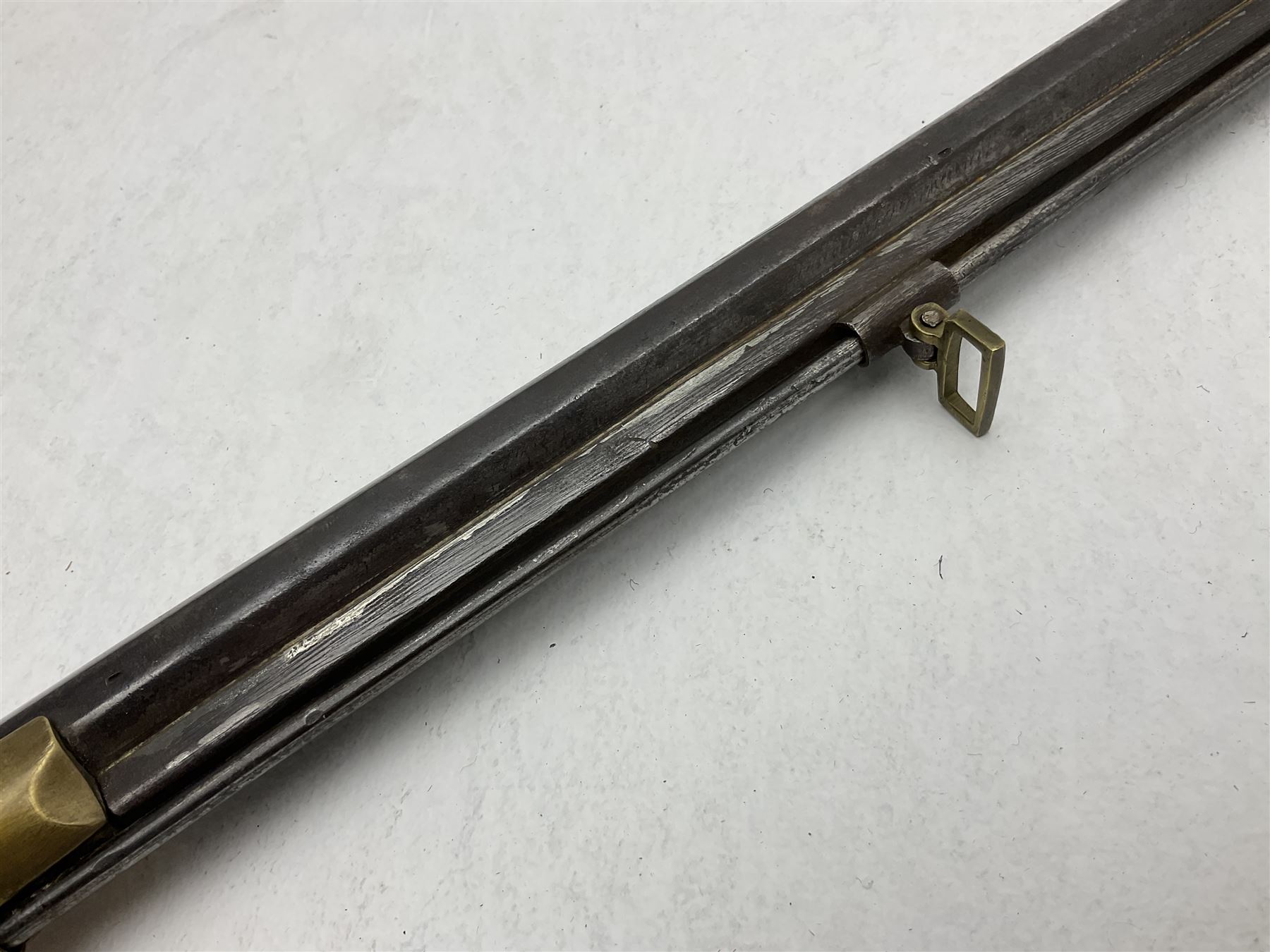20th century Indian percussion musket, the 81cm octagonal barrel with under rib and ramrod, brass fittings including front and rear swivels, oak half stock with cheek piece and chequered pistol grip stamped 1589 L124.5cm overall