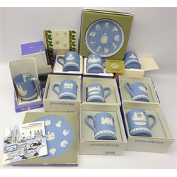  Nine Wedgwood blue jasperware Christmas tankards, consecutive run 1971 - 79, all boxed, together with two blue jasperware plates for 1976 Montreal Olympiad and London Landmarks, both boxed (11)  