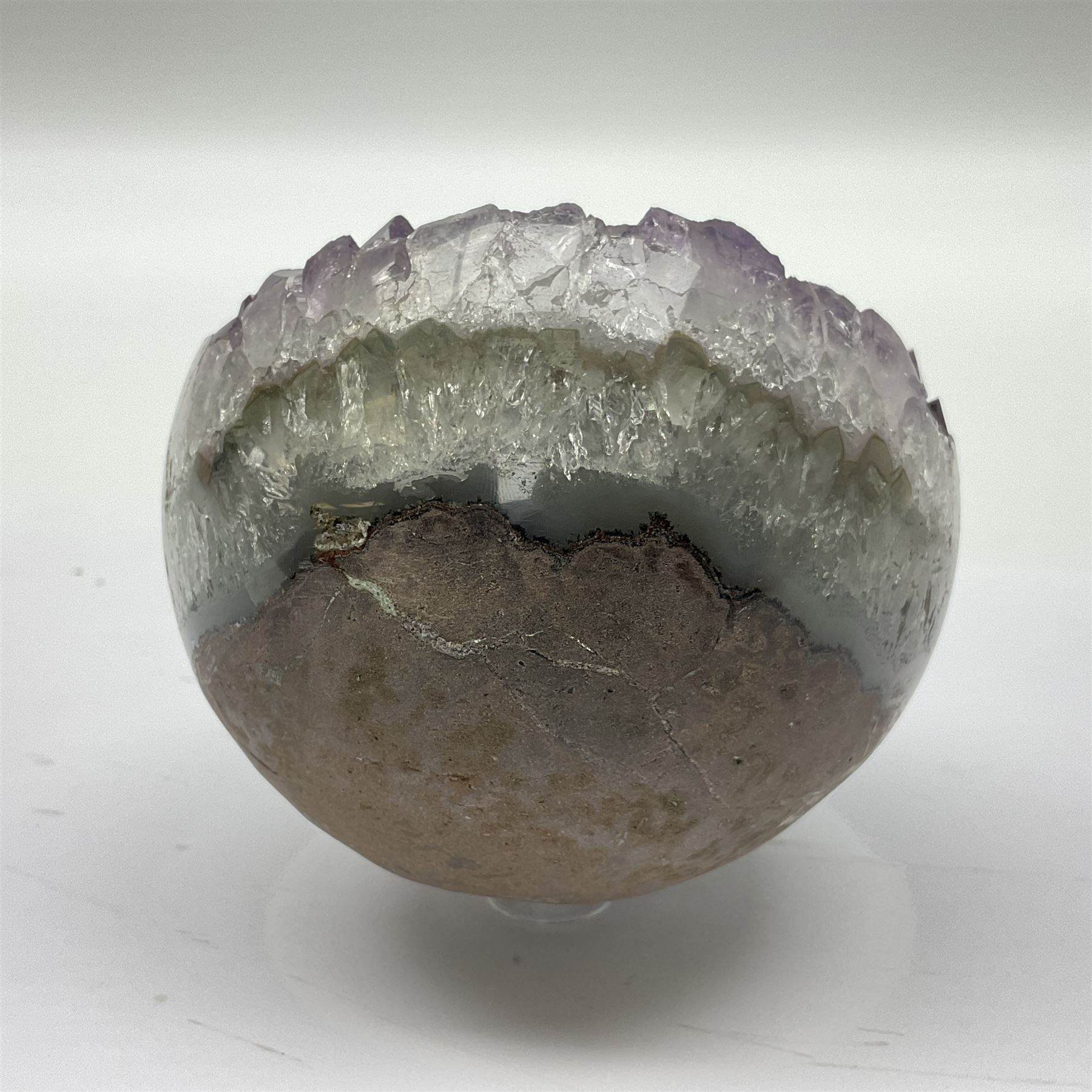 Pair of amethyst geode spheres, with purple crystalline internal formations, D9cm