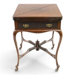 Edwardian carved mahogany envelope card table, the rectangular quadruple hinged top enclos...