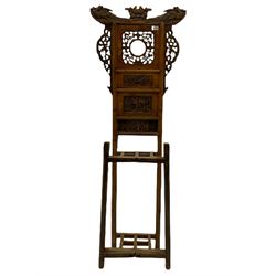 Chinese hardwood hall stand, the raised back surmounted by ho-ho birds and carved with pierced floral fretwork and relief carved panels, four division umbrella stand, turned front supports
