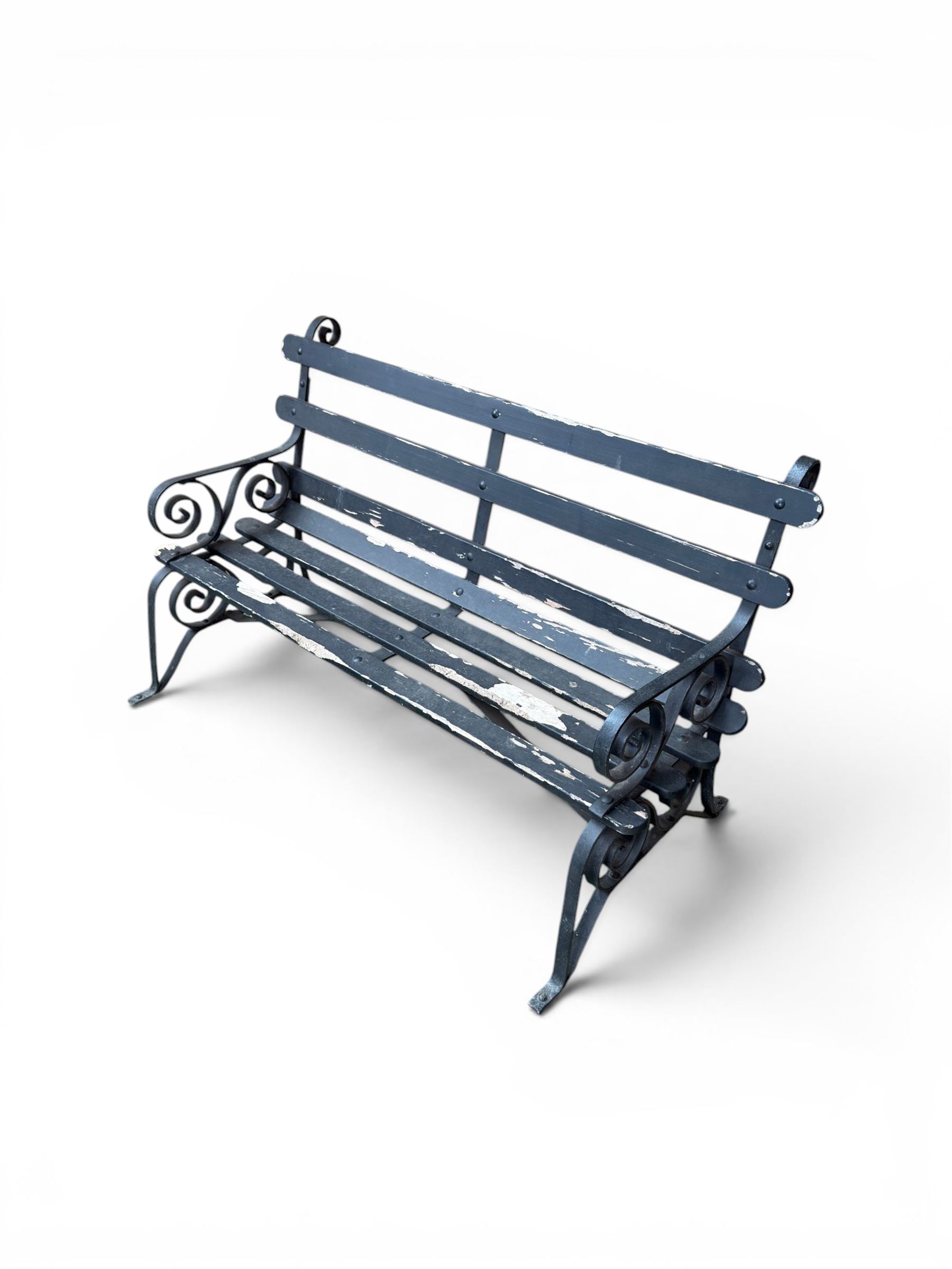 Coalbrookdale - rare pair of wrought iron and slatted wood garden benches, the twin wrought iron strapwork bench-ends formed of four scrolls over splayed feet, number 77 in the Coalbrookdale Castings Catalogue (see illustration)