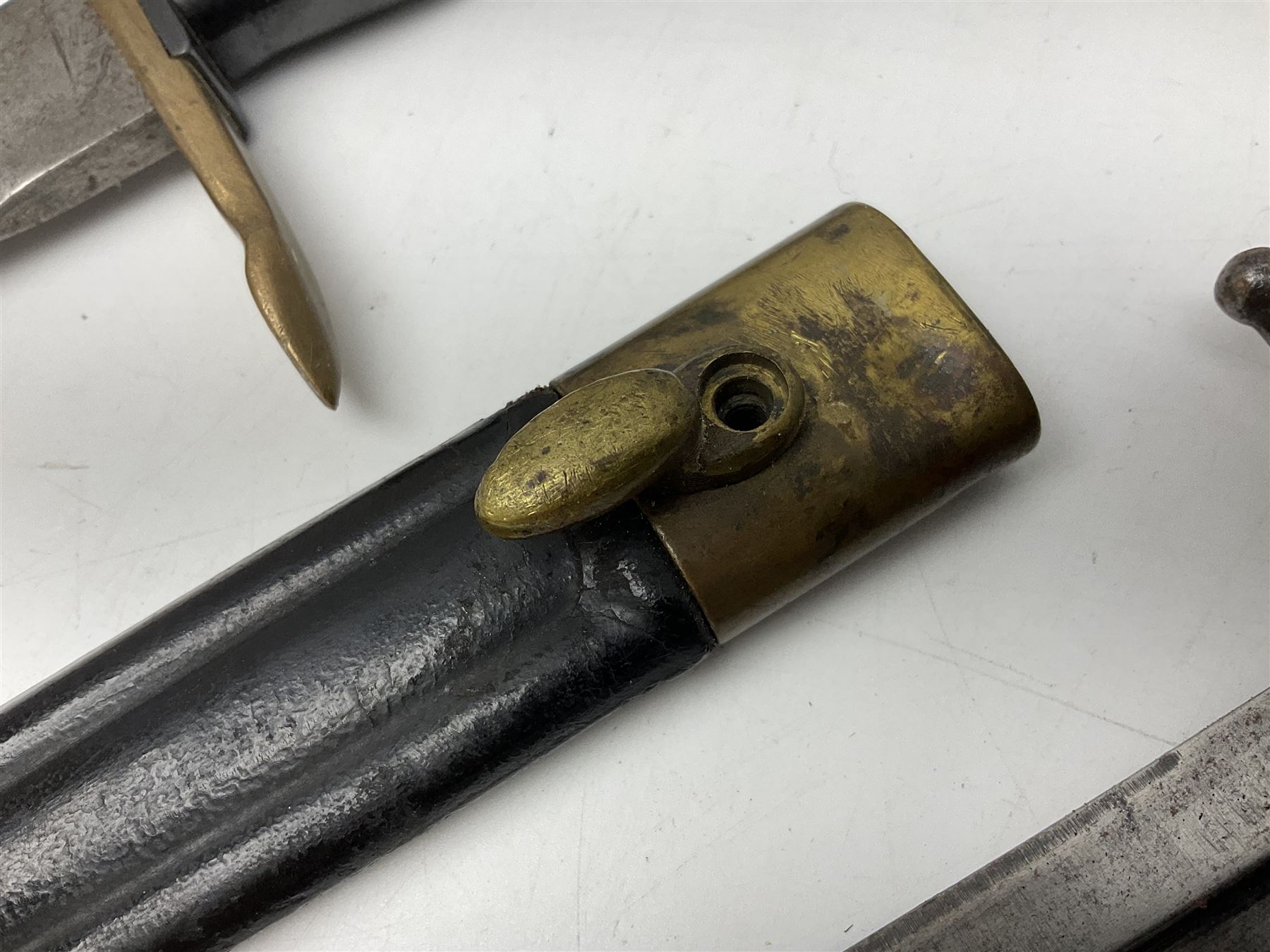 Italian Model 1891 bayonet with 30cm fullered blade; the crosspiece marked 'TERNI'; in associated brass and leather scabbard L43cm overall; and Knights Templar (?) short blade sword (no scabbard) (2)