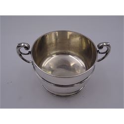Late Victorian silver twin handled bowl, of circular form with girdle and twin flying scroll handles, upon a short spreading foot, hallmarked Henry Stratford, London 1896, including handles H9.5cm D12cm, approximately 9.68 ozt (301.3 grams)