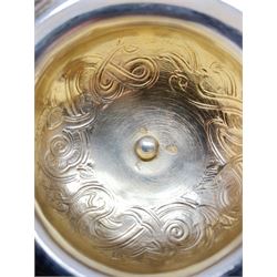 Late 19th century Danish silver drinking horn and cover, the body with hexagonal and beaded finial, raised upon two talon feet and further scroll foot, chased with scrolling foliate and zoomorphic bands, the detachable domed cover with conforming decoration surmounted by a figure holding a hammer, the cover interior impressed with maker's mark (partly worn and indistinct), alongside Danish Three Towers mark for 1881, with the Assay Master mark for Simon Groth (1863-1904), H23.5cm, weight 14.75 ozt (459 grams)

