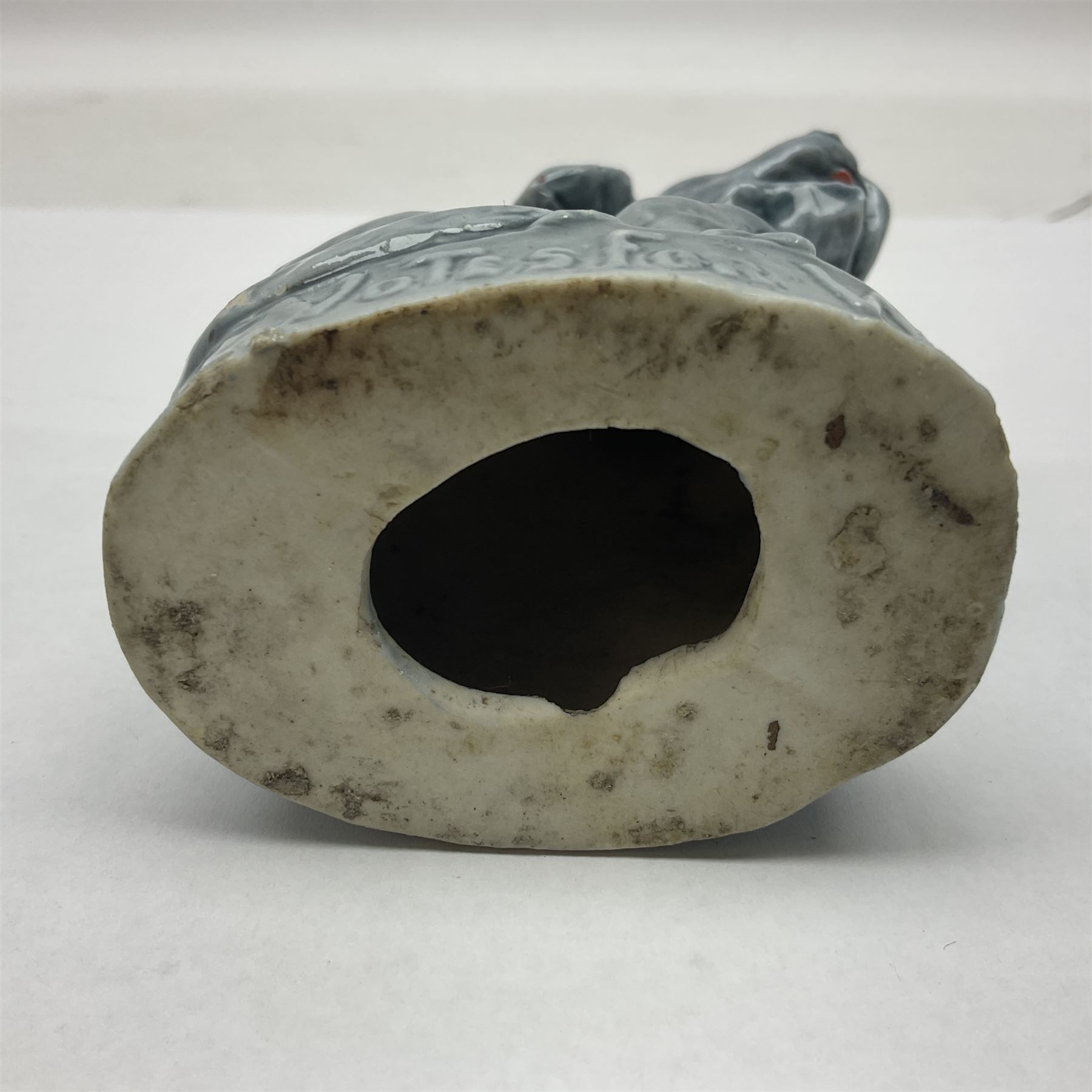 Suffragette blue glazed moulded ceramic dog, inscribed Votes For Women, H9cm