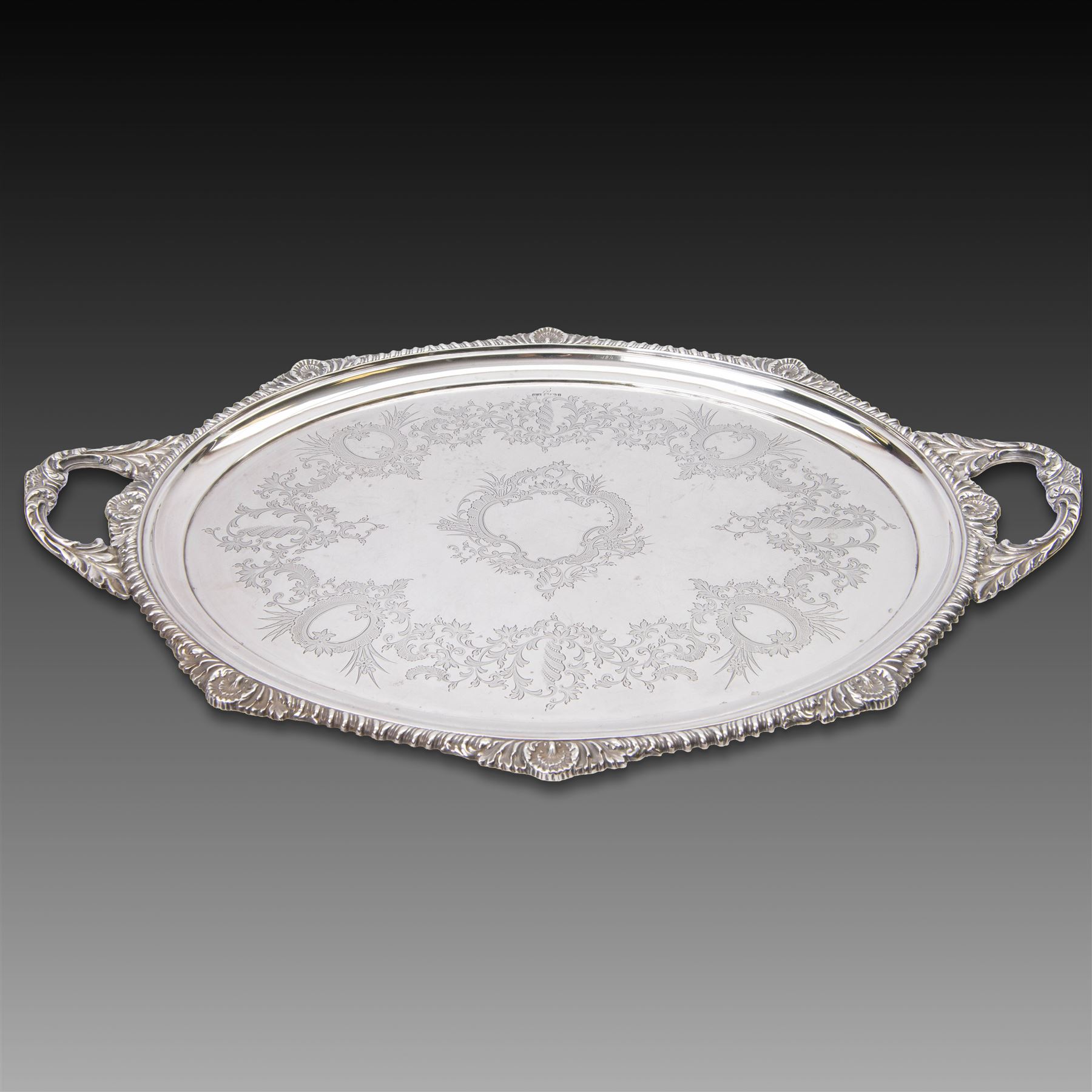 Victorian silver twin handled tray, of oval form, engraved with floral and foliate swags with vacant cartouche to centre, with oblique gadrooned rim, palmette details and foliate decoration to handles, hallmarked Atkin Brothers, Sheffield 1901, handle to handle W70cm