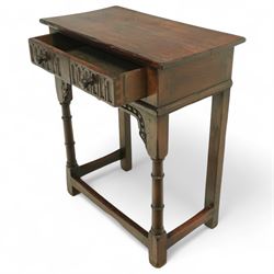 Titchmarsh & Goodwin style oak side table, rectangular top above a carved frieze drawer fitted with turned knobs, raised on block and baluster legs with plain stretchers 
