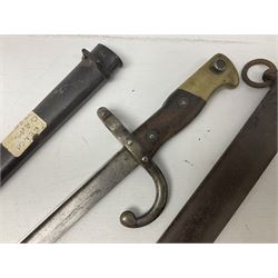French Model 1874 Epee bayonet marked Oulle 1876 in associated scabbard; Model 1866 sabre bayonet in cut-down sword scabbard; and Model 1842/59 sabre bayonet in relic condition (3)