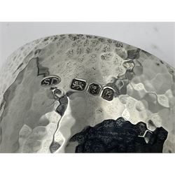 Pair of modern silver goblets by Stuart Devlin, the tapering cylindrical bowls each with spot hammered decoration and gilt interiors, the parcel gilt stems with signature textured detailing and six graduating knops, upon conforming spreading circular foot, hallmarked Stuart Devlin, London 1976, H17.7cm