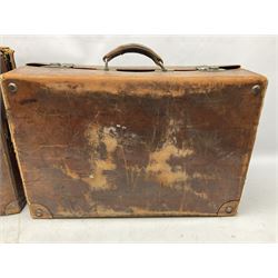 Early 20th century leather suitcase marked to the top 'Major P.M. Newton R.E. Crossways, Bridlington, East Yorkshire' 60 x 40cm; another similar leather suitcase marked W.D. to the lid; three post-WW2 respirators; and three unopened pairs of British Army N.B.C. (Nuclear Biological Chemical) No.1 Mk.III Trousers Protective (8)