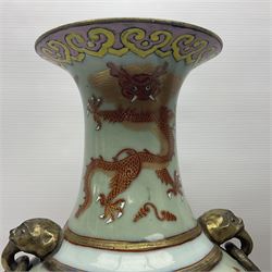 Pair of early 20th century Chinese vases decorated with dragons chasing a flaming pearl, with a gilt border of butterflies and floral sprigs, with Elephant head handles, H44cm 