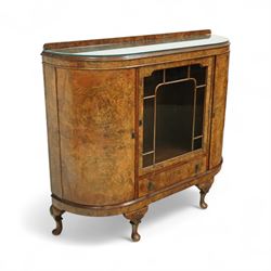 Early 20th century burr walnut display side cabinet, the glass inset top over a central glazed door with geometric astragal glazing, flanked by curved cupboards, shaped apron fitted with drawer, on cabriole legs with shell carved knees and pad feet