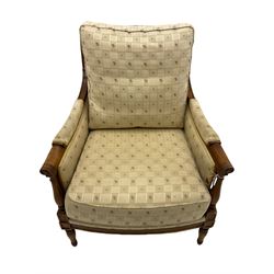Wesley Barrell - beech framed armchair, upholstered in floral patterned fabric, on turned supports