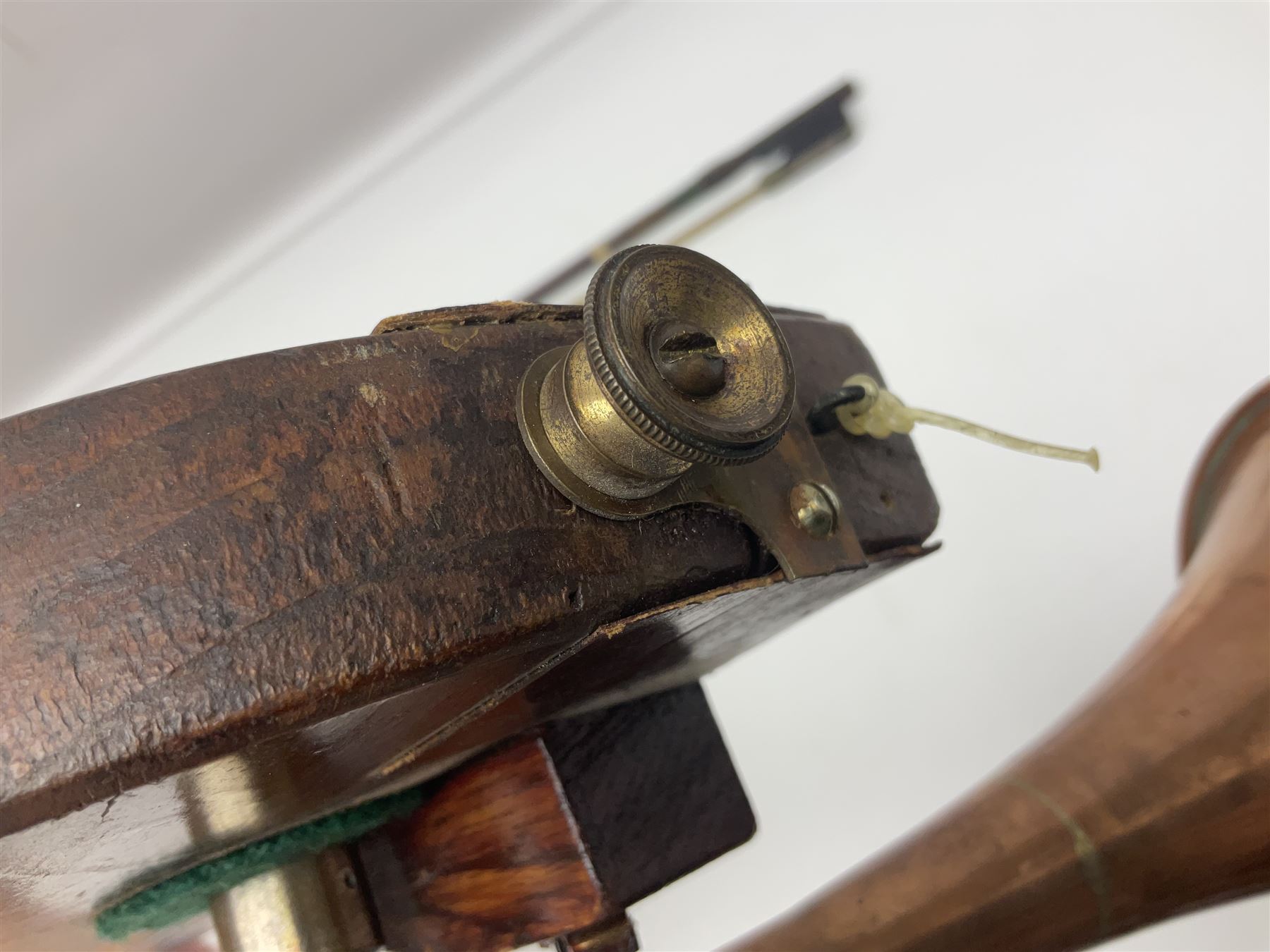 Fruitwood and elm single string phono fiddle with long neck and copper horn L76cm; and a violin bow (2)