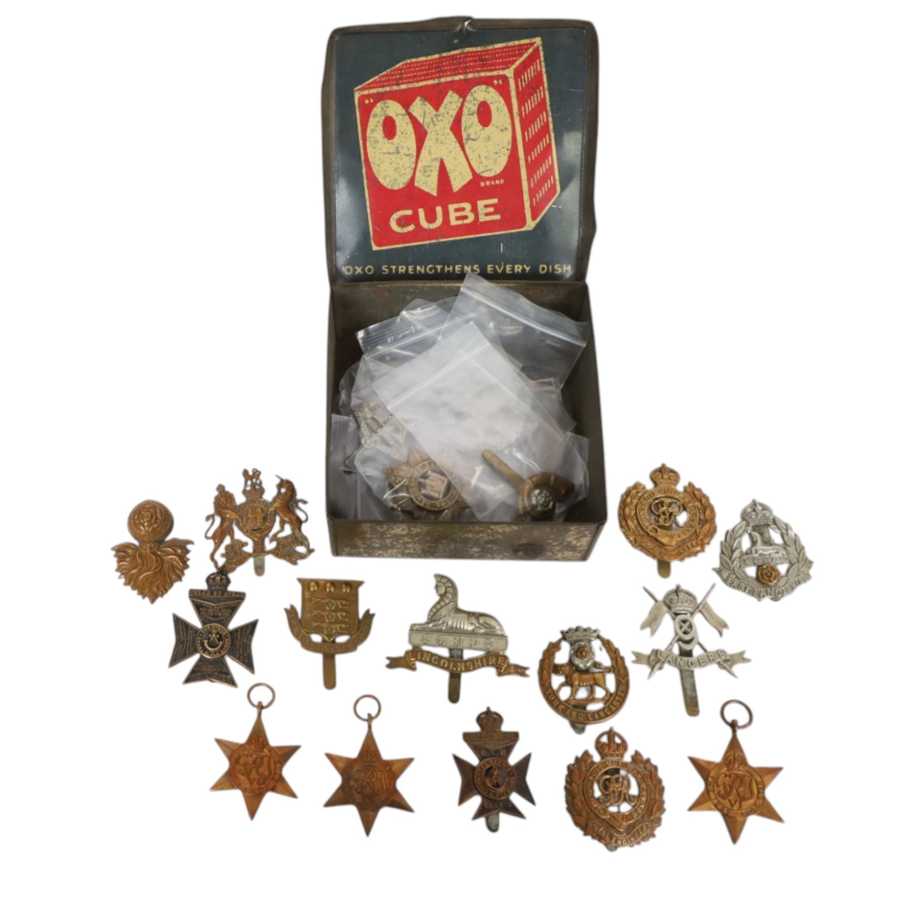 WWII seven British medals, comprising two War medals, two 1939-45 stars, African star, Italy star and French and German star, together with a collection of cap badges including The Kings Royal Rifles, Royal Engineers, East Lancashire, York and Lancaster regiment museum etc  
