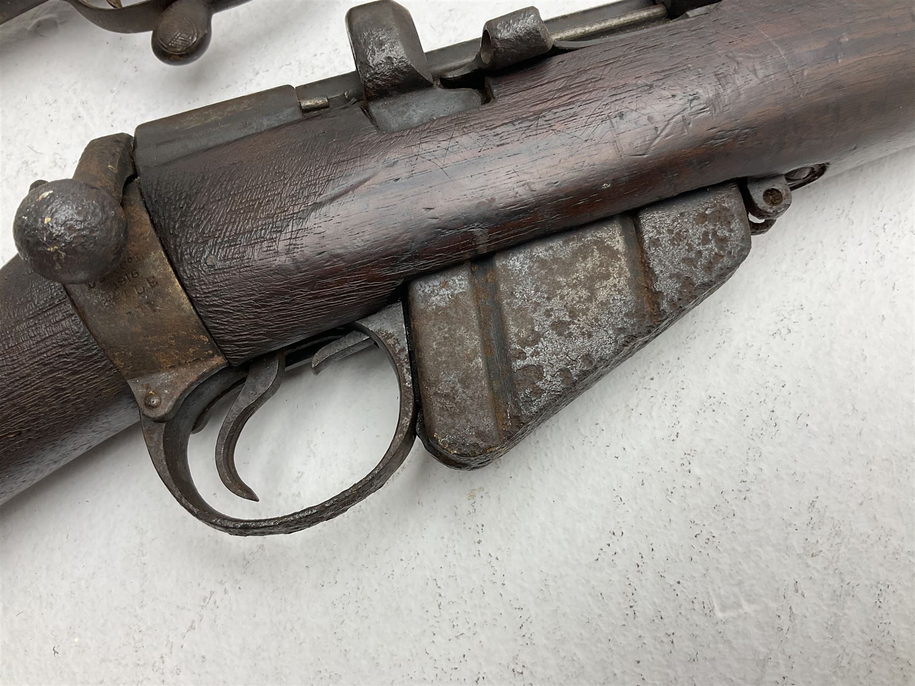 WW1 Lee Enfield SMLE .303 bolt action rifle with 63.5cm barrel and magazine; No.20934; L112cm overall; home deactivated by welding down bolt and end of barrel so requires re-deactivation to modern standards; and 19th century 12-bore double barrel hammer shotgun with 65cm cut-down barrels, non-rebounding hammers and under-lever opening, the lock-plate indistinctly inscribed G.T. Bartrant(?) L75cm overall; home deactivated by welding both barrels closed at breech so requires re-deactivation to modern standards (2) RFD ONLY 