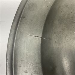 Group of seven 19th century pewter chargers, each of circular form with dished centre, two examples with touch marks verso, each approximately D39cm
