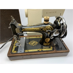 Two cased singer sewing machines. 
