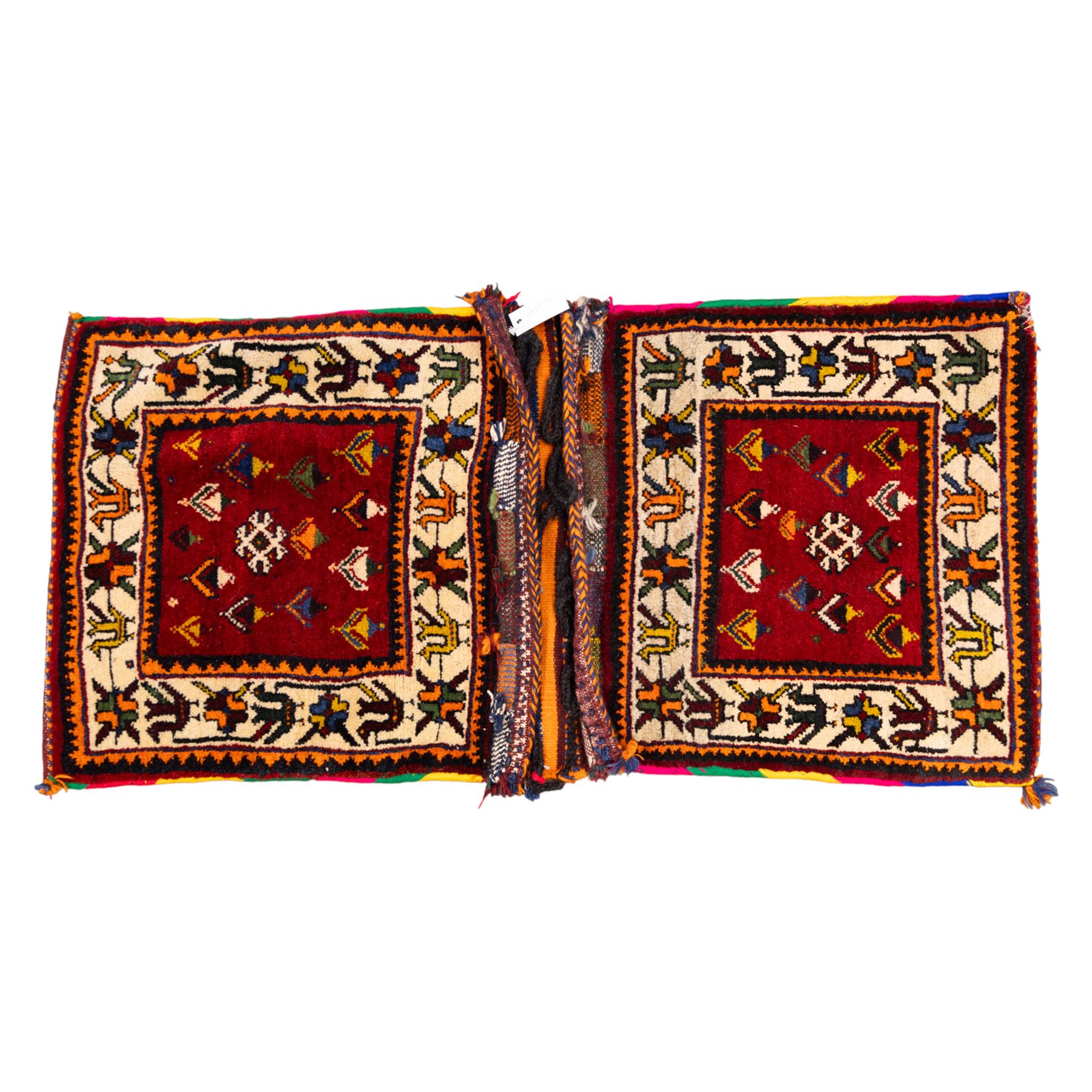 South West Persian Qashgai saddlebag, (Khorjin) saddlebag, comprising two pile-woven panels joined by a flatweave underside, each decorated with madder-red field filled stylized geometric motifs and hooked devices, enclosed by contrasting ivory borders populated with tribal figures and abstract forms
