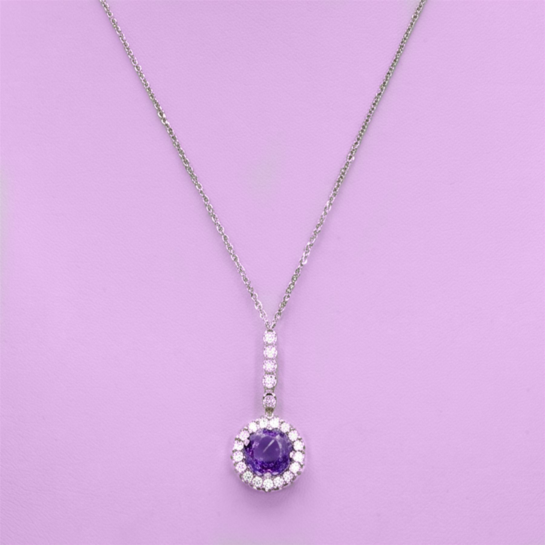 Early 20th century white gold silver amethyst and diamond pendant, round cut amethyst, surrounded by seventeen old cut diamonds, suspending from a five stone diamond set bail, to a silver chain necklace, total diamond weight approx 0.40 carat