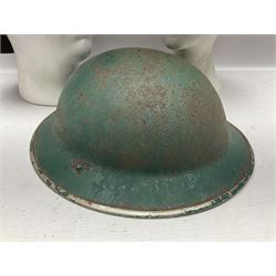 Three battlefield relic helmet shells - WWI German M16; WWI French Adrian; and WWII British (3)