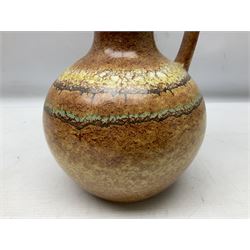 German floral decorated urn shaped lidded vase H38cm and mid-20th century ewer shaped vase with mottled brown glaze (2)