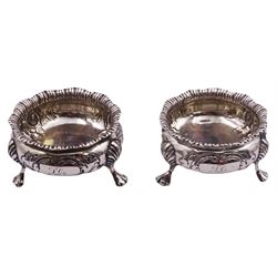 Pair of Victorian silver open salts, each of cauldron form with gadrooned rims and embossed flower heads to body, upon three paw feet, hallmarked Charles Stuart Harris, London 1892, approximate weight 3.05 ozt (95 grams)