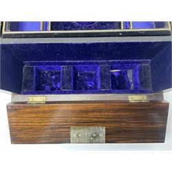 19th century walnut travelling toilet box, with shaped brass escutcheon and foliate engraved carry handle to the hinged cover, opening to reveal a blue silk and velvet lined interior with lift out tray, the fall front dropping to reveal three cut glass bottles with stoppers, H15cm W22.5cm D19.5cm