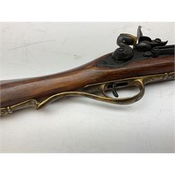 Reproduction non-firing Kentucky style flintlock musket musket, the 87.5cm hexagonal barrel with ramrod under, brass and brassed furniture and patch box to walnut stock L131cm overall