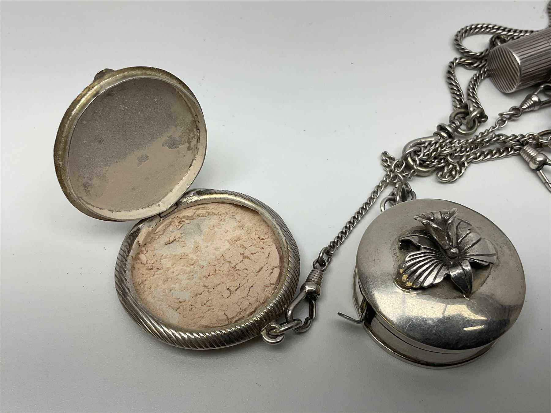 Victorian style silver chatelaine necklace, suspending eight silver sewing and similar accessories, including tape measure, needle case, pencil holder, powder compact and pill box
