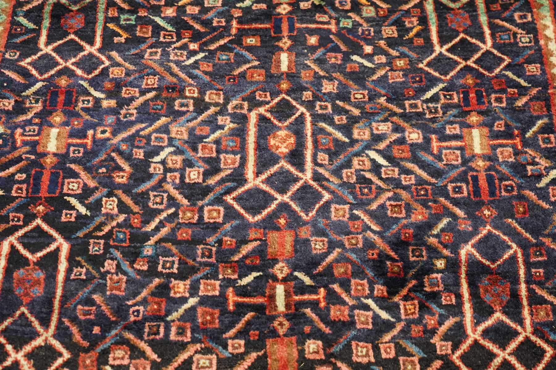 Large Persian indigo ground Herati runner rug, the busy field decorated with repeating geometric and Herati motifs in contrasting tones, enclosed by multiple guard stripes