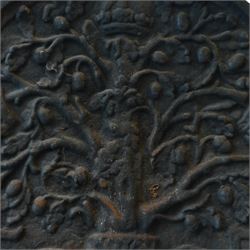 Early 20th century cast iron fireback, arched rectangular form cast in relief with a fruiting oak tree issuing acorns and leaves, surmounted by a crown, the trunk encircled by a ribbon tied cartouche with trailing scrollwork and foliate decoration, within a plain raised border
