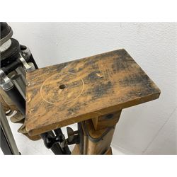 Three wooden adjustable tripods for plate cameras, together with a Linhof of Munchen metal tripod in a canvas case 