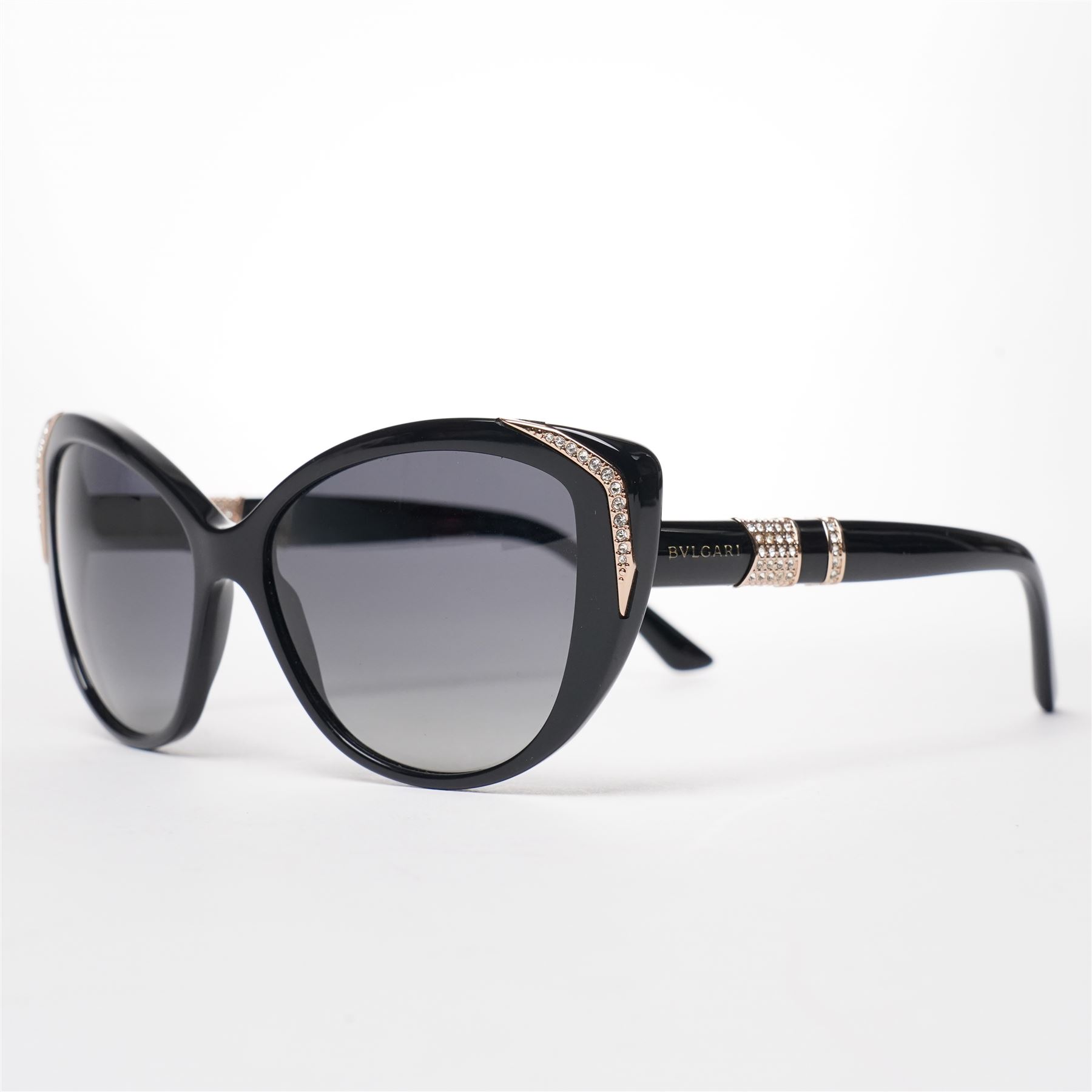 Bulgari - pair of oversized cat-eye sunglasses, with gradient tinted lenses in a black frame, the temples and arms with gold-tone hardware inset with pave-jewelled hinge detail, with original cloth pouch, hard leather case and box