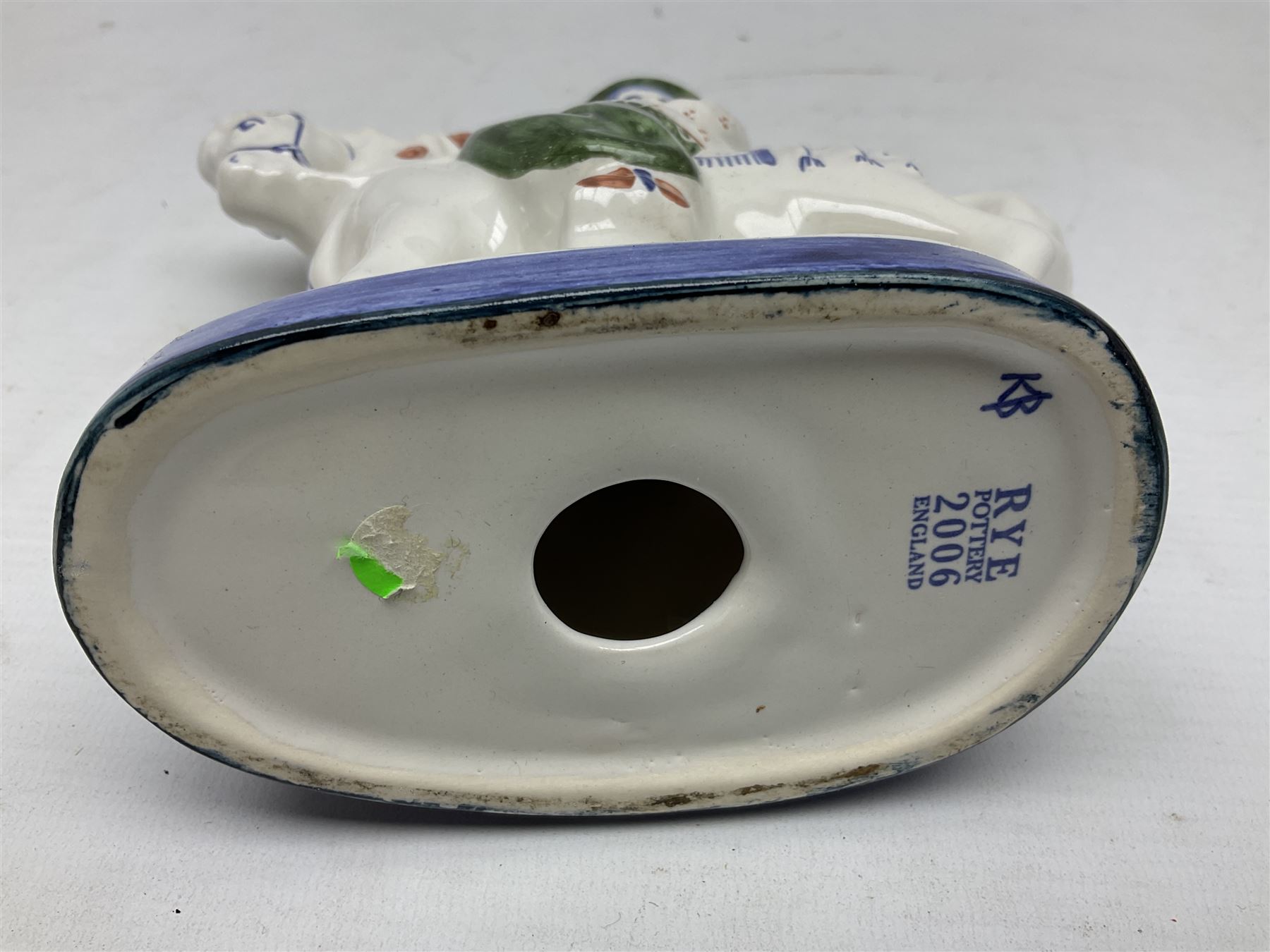 Rye pottery figure modelled as a lady upon a horse, with printed marks beneath, H19cm