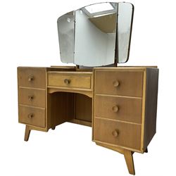 Meredew - mid-20th century oak kneehole dressing table, raised triple mirror back over seven drawers 