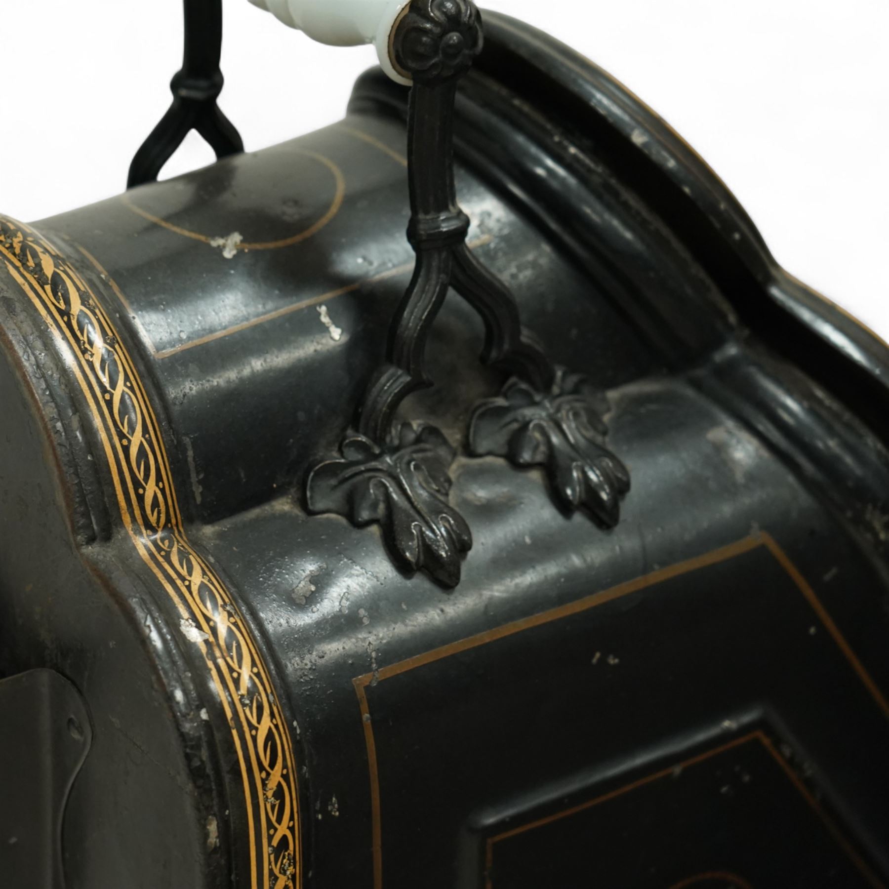 Victorian toleware coal scuttle, of shaped form hand-painted with fruit and floral spray to the hinged lid, with gilt line detailing, ceramic handle raised on wheels, brass coal shovel