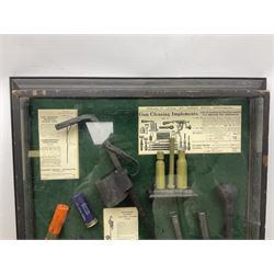 Wall hanging display case containing hunting ephemera to include cartridge boxes, snares, gun cleaning equipment etc