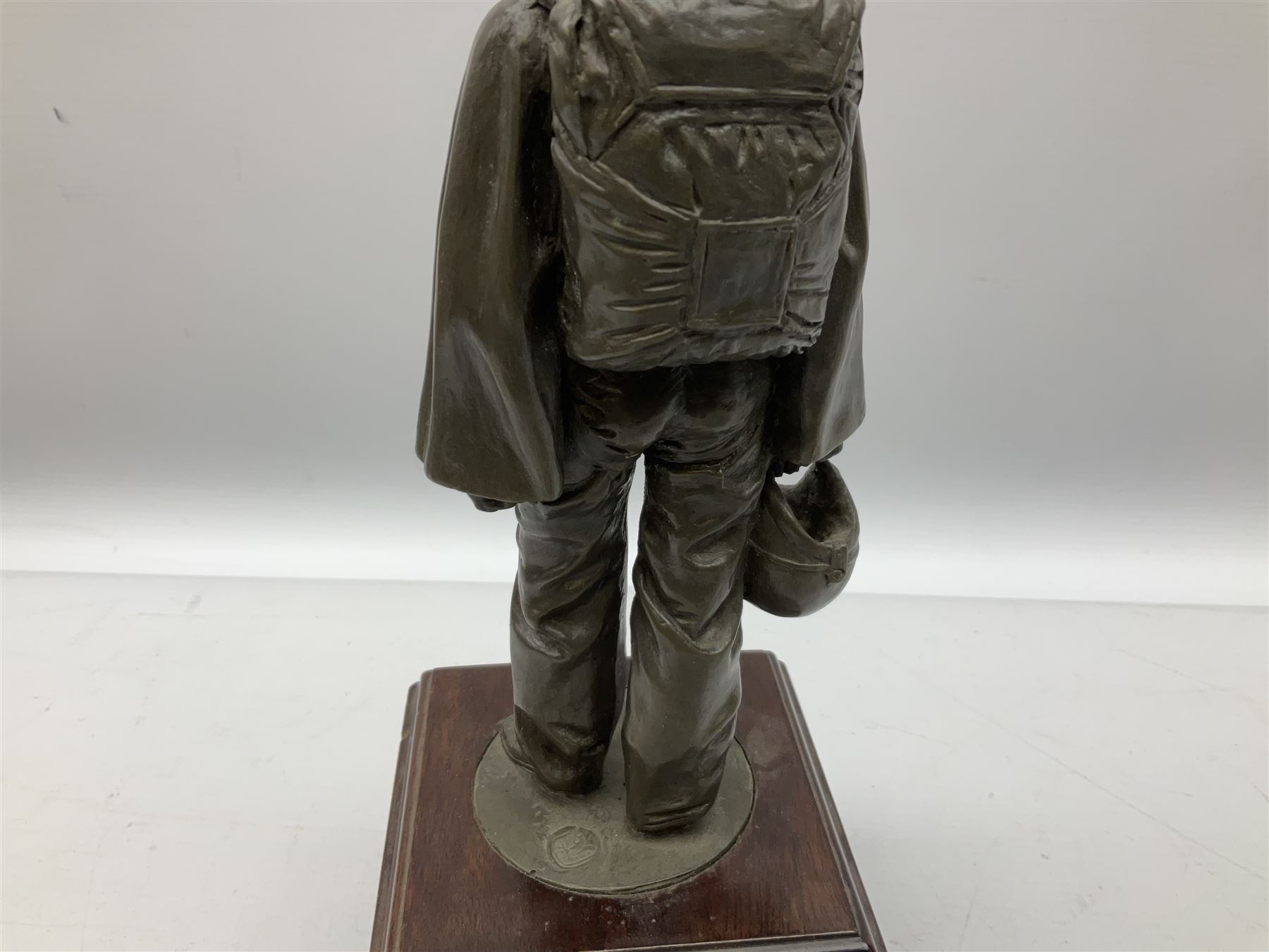 Presentation bronzed figure of a paratrooper by Peter Hicks mounted on a mahogany plinth with plaque inscribed ' Presented to Lieutenant General Sir Michael Gray KCB OBE President Army Parachute Association 1981-1987 An Outstanding Term of Leadership Friendship and Humour. Thank You All Ranks A.P.A.' H28cm; a brass Pegasus plaque H12cm; and small quantity of colour photographs and prints of military related paintings