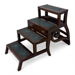 In the manner of Morgan & Sanders - early 20th century Regency design mahogany metaphoric library chair and steps, rectangular panelled top-rail with applied roundels with scrolling arms and upholstered seat and cushion, hinged and folding design transforming into four carpeted steps

Reference: The present lot is based on a design for a metamorphic library chair published by Morgan & Saunders circa 1810, P.Agius, Ackermann's Regency Furniture & Interiors, plate 29, page 60