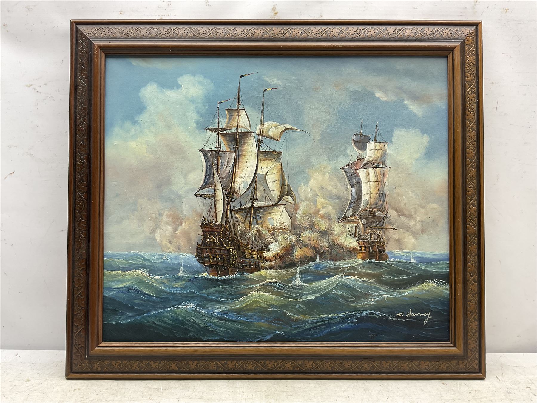 J Harvey (20th century): Naval Battle, oil on canvas signed 49cm x 59cm