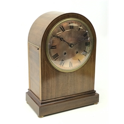  Large Edwardian inlaid mahogany arched top bracket clock with silvered Roman dial, twin train movement striking the quarter hours on two coils, brass bun feet, H41cm  