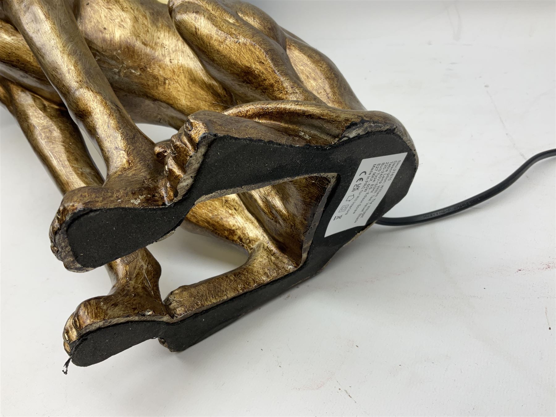 Composite table lamp, modelled as a gilt seated whippet, with teal velvet shade, H71cm
