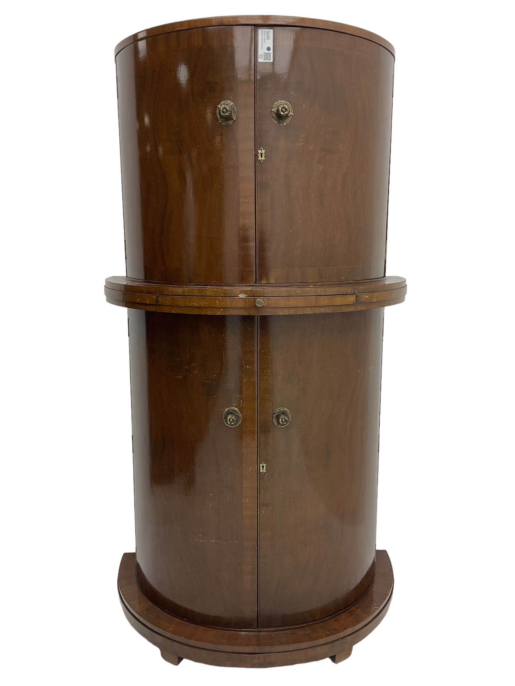 1930s Art Deco walnut demi-lune cocktail cabinet, enclosed by four curved doors, the upper section with mirrored interior, glass shelf and glass holders, the lower section fitted with shelves and bottle holders