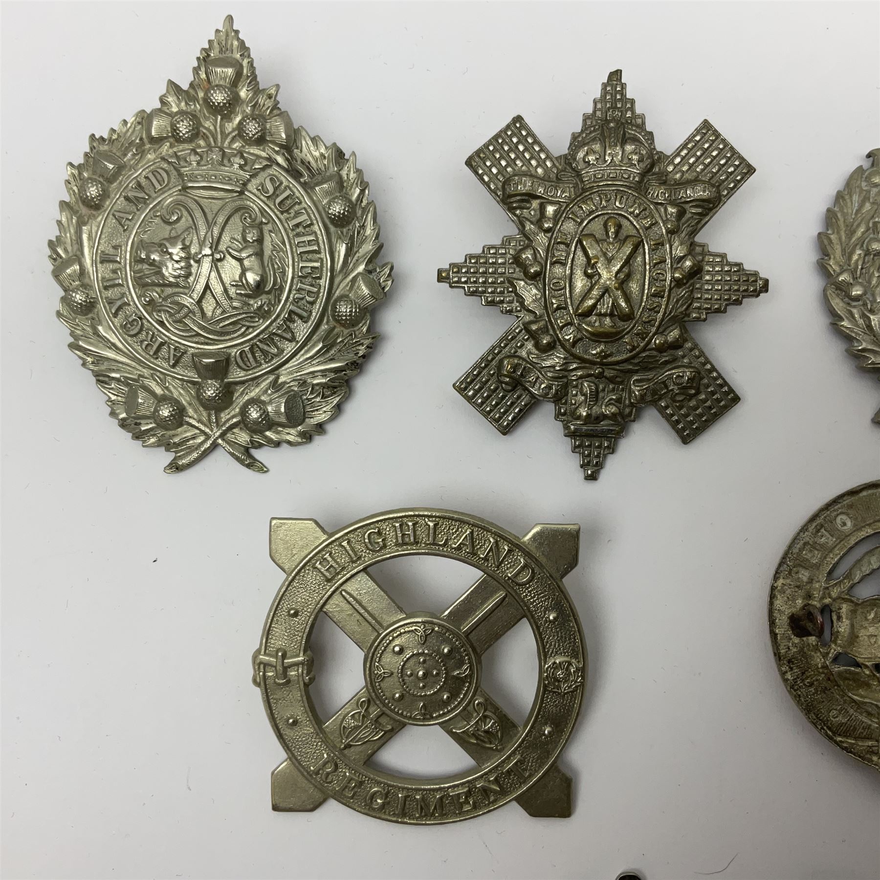 Nine Scottish glengarry badges - 6th Fifeshire Volunteer Battalion Black Watch, Lowland Regiment, Highland Regiment, Black Watch, Argyll & Sutherland Highlanders, Kings Own Scottish Borderers, Cameron Highlanders, The Royal Scots and London Scottish (9)