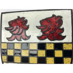 Henry George Murphy (1884-1939), Arts & Crafts enamel panel, of shield form, decorated with three red lions on a white ground, with a yellow and black banner to the centre, H9cm W7.5cm