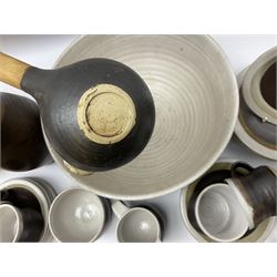Marianne De Trey (British 1913-2016) stoneware coffee service for twelve, together with a large deep stoneware footed bowl and ladle with wood handle, all decorated in Manganese 'Pattern 1' with impressed shell marks, bowl D27cm